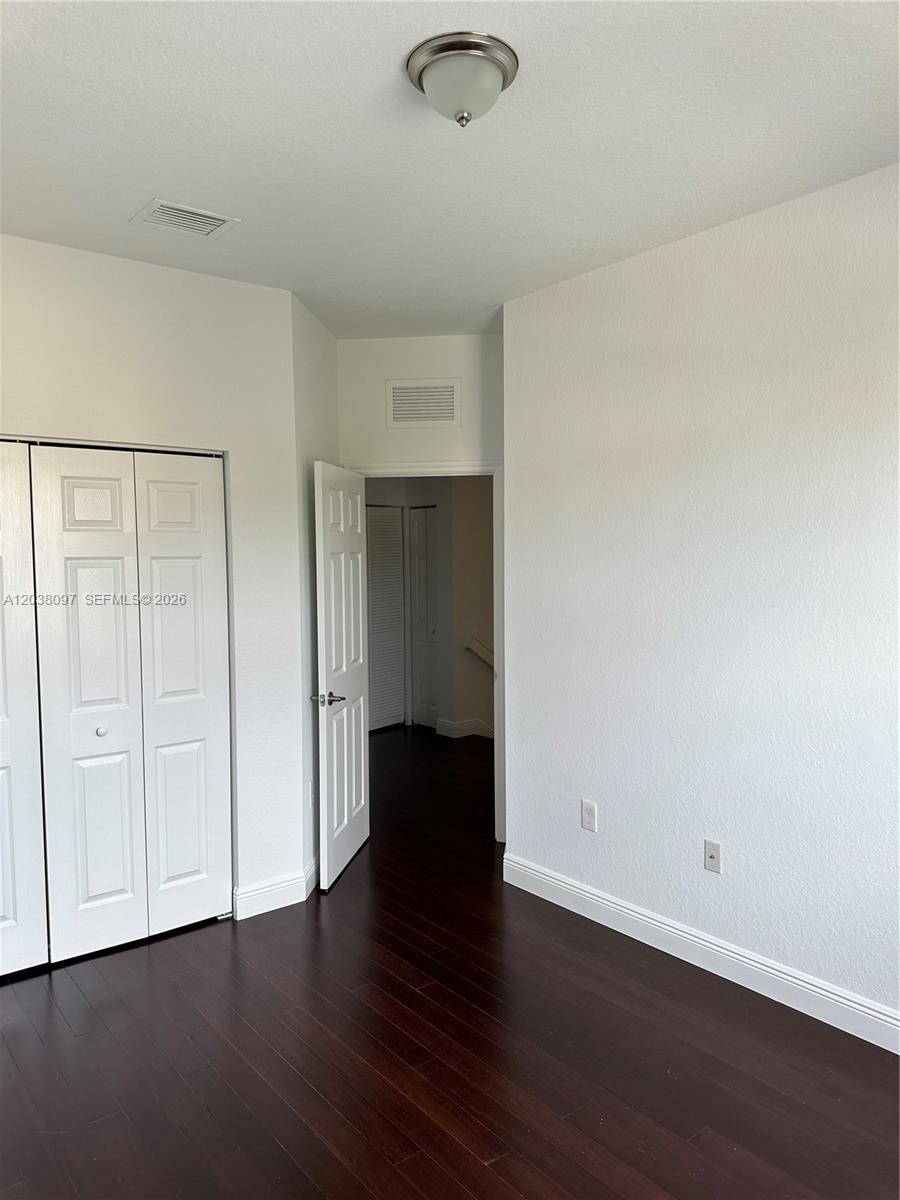 Coral Lakes Kingdom townhouse — upstairs wood floors in second bedroom — 2555 SW 147th Path Miami FL 33185