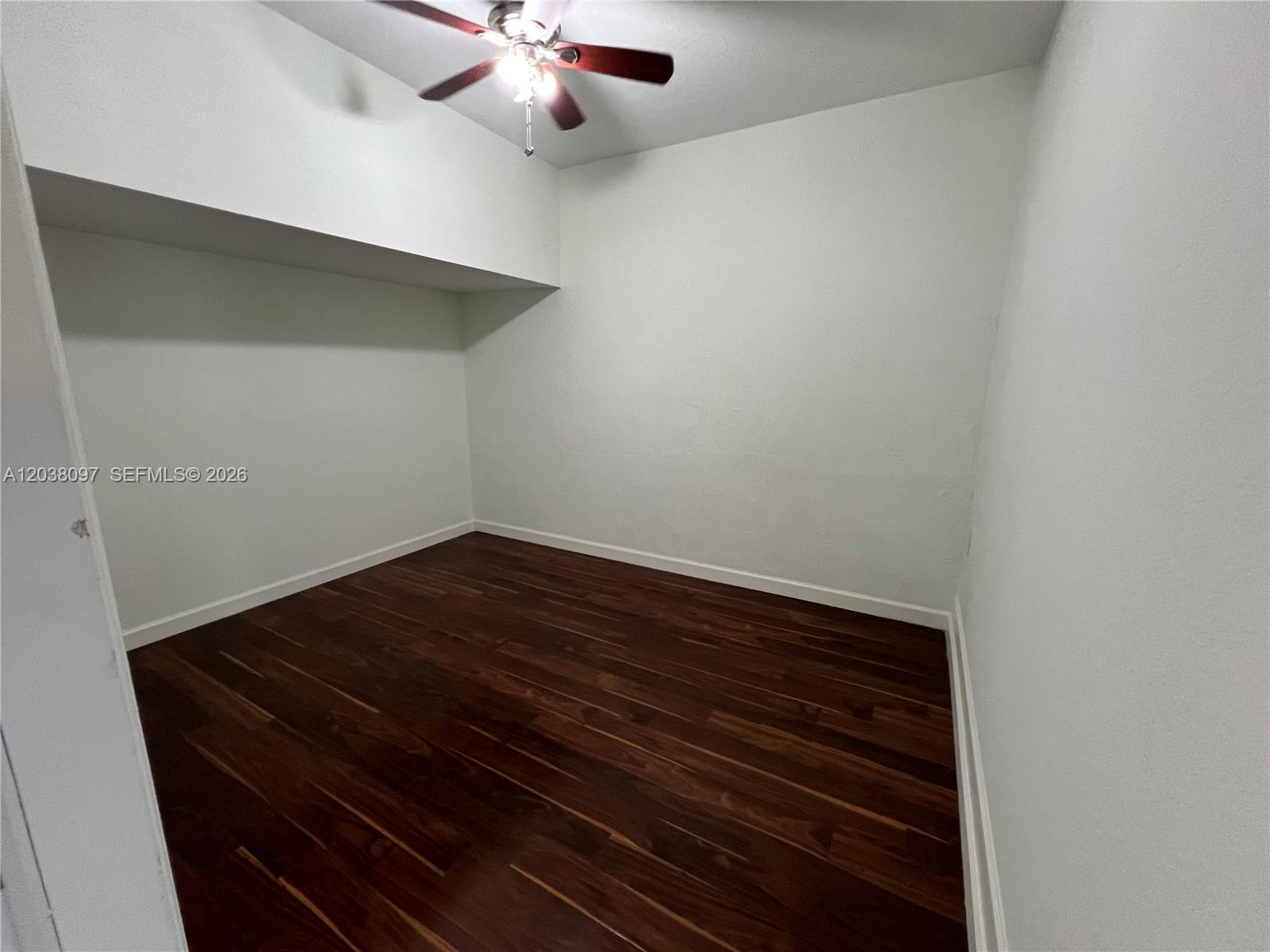 Coral Lakes Kingdom townhouse — kitchen with stainless steel appliances and wood cabinets — 2555 SW 147th Path Miami FL 33185