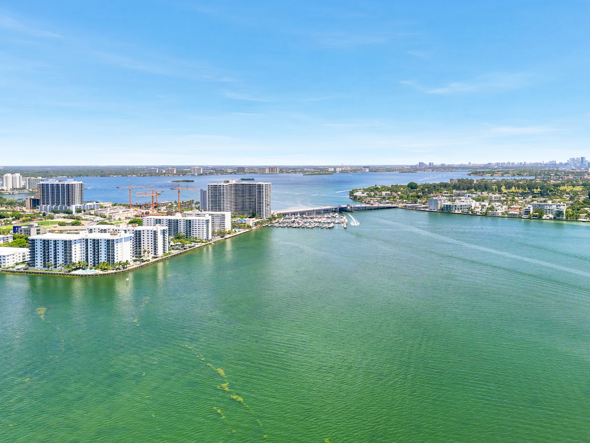 Treasures on the Bay II — bayfront building and pool area — 7501 E Treasure Dr #2S North Bay Village FL